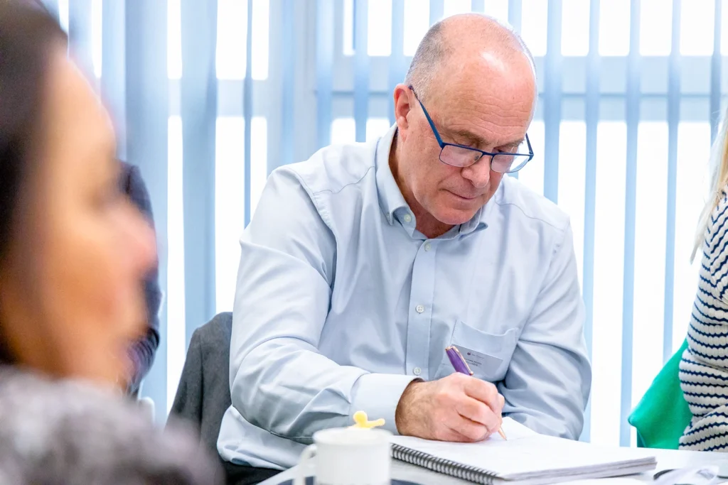 Man writing in notebook